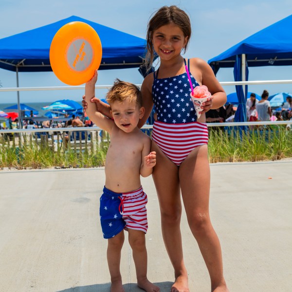 a young boy standing on a beach
