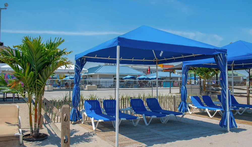 A blue cabana at the beach.