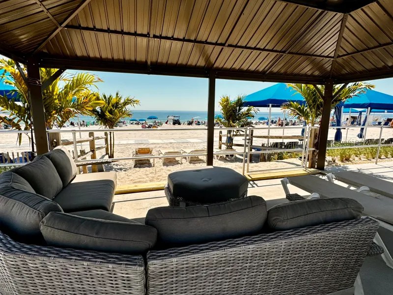 a living room filled with furniture and a large window
